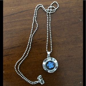 Silver necklace with a beautiful blue jewel flower